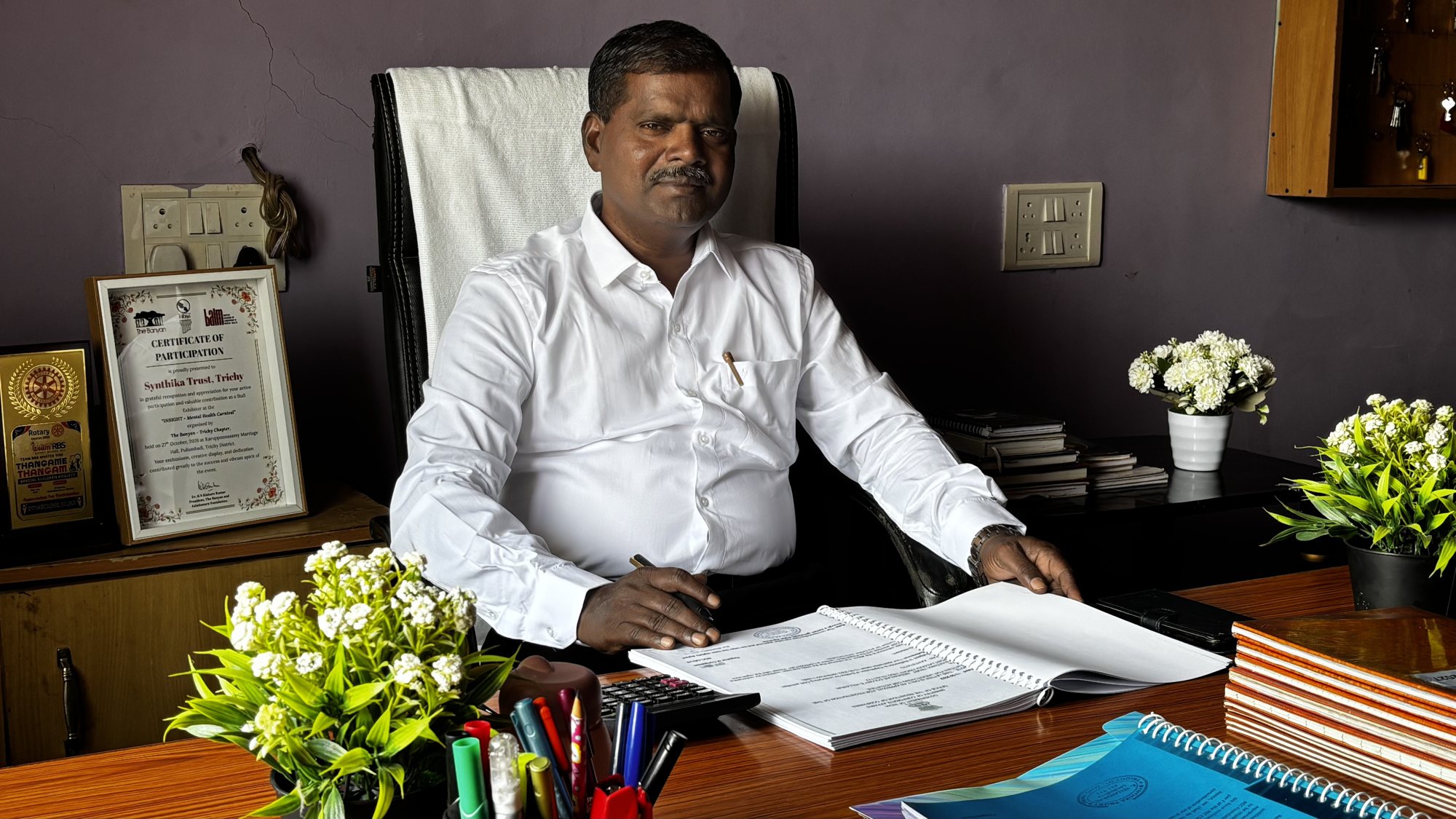 Mr. T. Selvaraj, Founder and Managing Trustee of Synthika Trust, at his desk